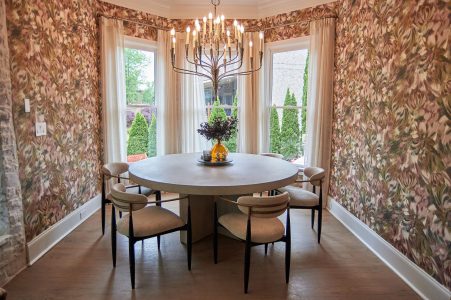 Breakfast nook framed in bold floral wallpaper