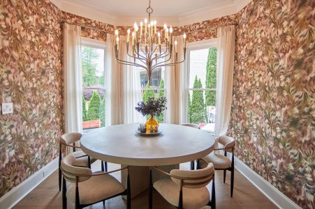 Breakfast nook with floral wallpaper and statement chandelier