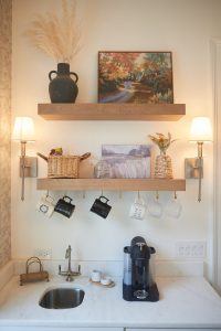 Coffee and beverage station with floating wood shelf and bar sink