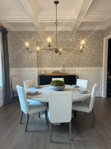 Dining room with coffered ceiling, gray wallpaper and lantern chandelier