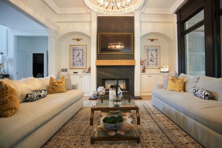 Great room with blue sofas and patterned area rug