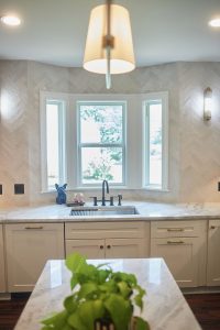 Kitchen marble countertop detail beside a bright window