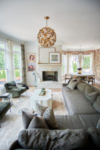 Living room with fireplace and gray sofa seating