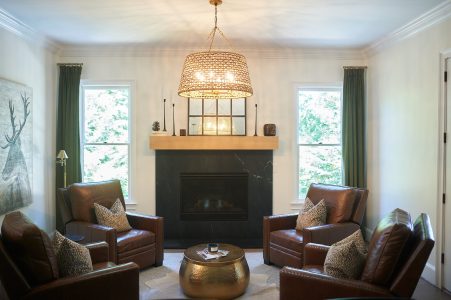 Living room with leather club chairs and fireplace