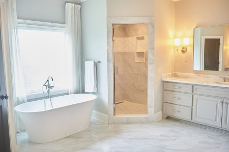Master bathroom with freestanding tub and walk-in shower